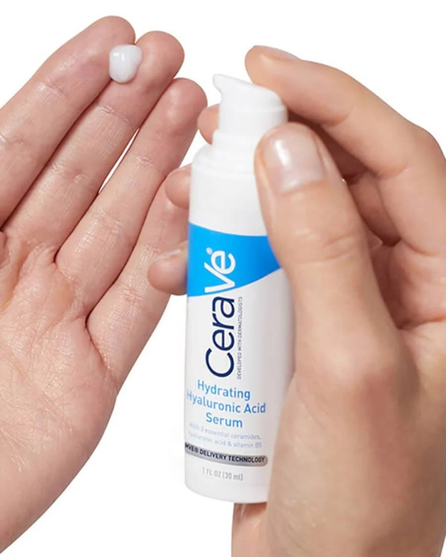 CeraVe serum bottle held between two hands with a white background